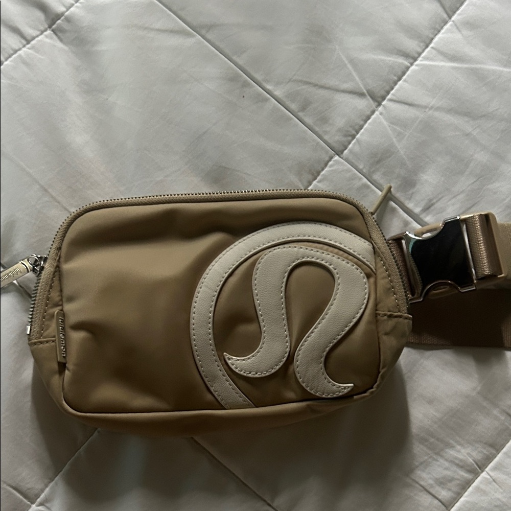 White & tan Lululemon belt bag